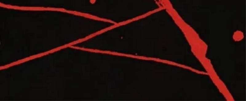reticolo di crepe color rosso su sfondo nero
