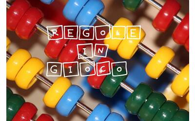 dettaglio di un pallottoliere con sovrapposta la scritta regole in gioco